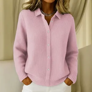 Detailed shot of a pink waffle knit long sleeve button-up cardigan with collar for women.