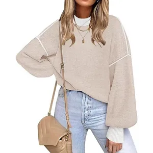 Detailed view of women's casual lantern sleeve knit sweater showing textured knit fabric.