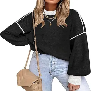 Casual knit sweater with contrast colorblock design, crewneck and cozy lantern sleeves.