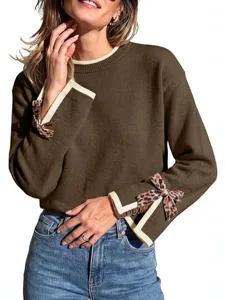 Women brown crewneck long sleeve knit sweater with leopard bow cuff detailing main product view.