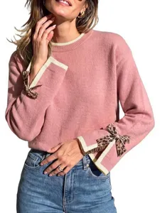 Women's stylish pink crewneck knit sweater with chic leopard bow cuffs for autumn winter.