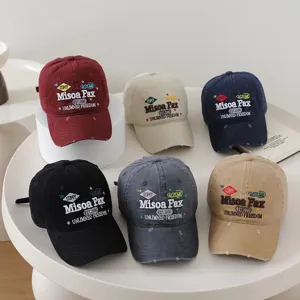 Detailed view of vintage embroidered letter baseball caps, soft top casual dad hats for all.