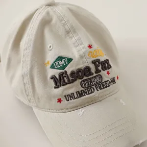 Vintage washed cotton baseball cap with stylish front embroidery letters for unisex daily wear.