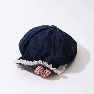 Kids denim beret hat detail, retro style with white lace trim and red checkered bow.