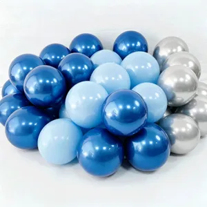 Close-up detail of blue and silver metallic balloons cluster scene decoration setup.