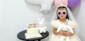 Children birthday party decoration supplies set with balloons, glasses and plush toys.