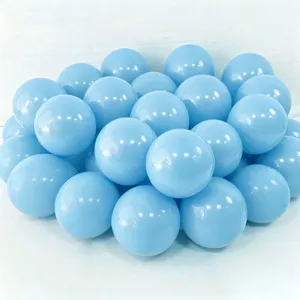 Bright light blue party balloons cluster details for festive birthday celebration scene.