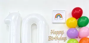40 inch white number balloon details and colorful setup for birthday party.