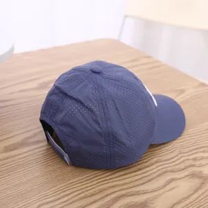 Breathable quick-dry baseball cap detail showing mesh fabric and adjustable back strap.