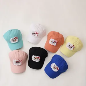 Details of cute kids baseball caps featuring lovely lace patches and colorful cotton designs.