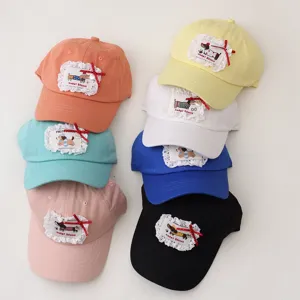 Cute kids baseball cap with lace bow and puppy patch, colorful summer outdoor sun hat.