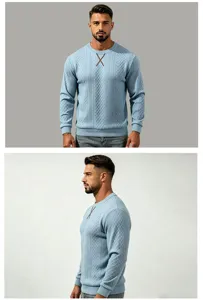 Close-up details of men's light blue knit pullover sweater showcasing jacquard texture.