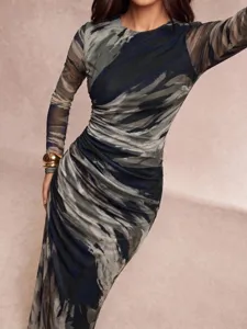 Detailed view of the elegant abstract print long sleeve dress, highlighting the slim fit.