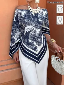 Chic two-piece set featuring a blue and white printed off-shoulder top and white trousers.