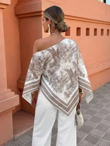 Detailed view of the stylish off-shoulder printed irregular half-sleeve top for women.