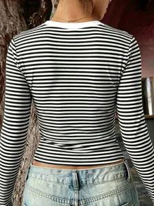 Back view detail of a women's casual black and white striped slim long sleeve top.