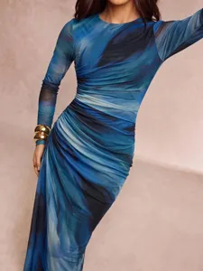 Close-up view of the elegant blue abstract marble print long sleeve maxi dress detail.