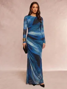 Detailed view of women's blue marble print long sleeve maxi dress with slim fit.