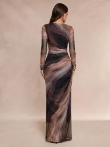 Back detail of women's long sleeve marble print maxi dress, showcasing fit and fabric texture.