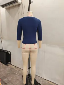 Back view of solid blue slim fit three-quarter sleeve top detail, casual everyday style.