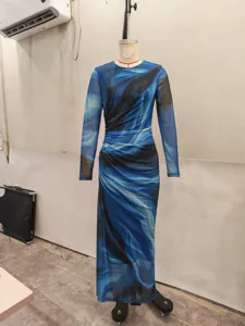 Detailed view of long sleeve blue marble print mesh dress, highlighting abstract fluid pattern.
