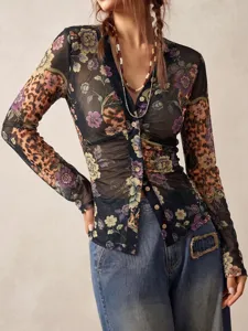Close up of floral and leopard mesh long sleeve button down shirt, vintage style.