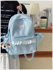 Zaino scolastico azzurro stile coreano con grazioso fiocco bianco e volant in pizzo.