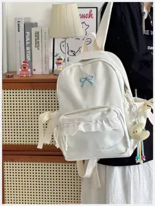 Zaino da studente bianco in stile coreano con grazioso fiocco blu e dettagli in pizzo.