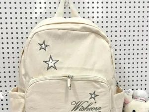 Zaino in tela con dettaglio ricamato a stella, borsa scolastica giornaliera per ragazzi.