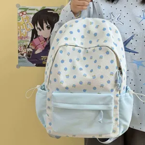 Zaino da studente stile coreano carino dettaglio, design floreale azzurro e bianco, casual.
