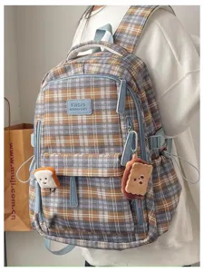 Detail view of Japanese vintage plaid school backpack with cute plush toast charms and storage.