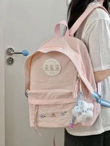 Mochila rosa bonita con parche de osito para niñas, bolso casual texturizado suave para viajar.