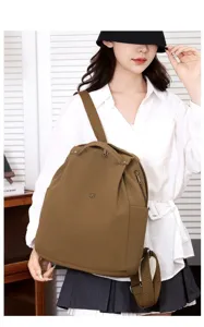 Korean style lightweight nylon backpack detail shot, brown oxford fabric school bag travel.