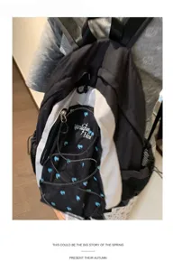 Korean style heart backpack detail view, color block design, large capacity casual school bag.
