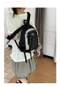 Korean style color block backpack with blue heart pattern, casual campus schoolbag for women.
