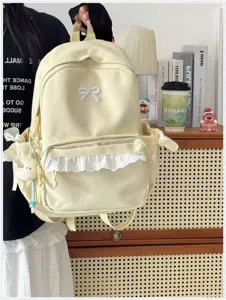 Zaino in tela gialla in stile coreano carino con fiocco bianco e volant per studenti.