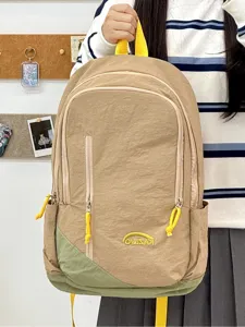 Mochila informal ligera para mujer, bolso escolar de nylon vintage con bolsillo frontal.