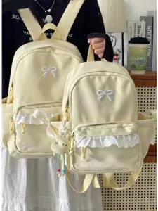 Zaino giallo carino in stile coreano con fiocco e pizzo, ideale per studenti e uso quotidiano.