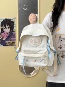 Mochila escolar minimalista de estilo coreano con parche de osito y bordado floral.