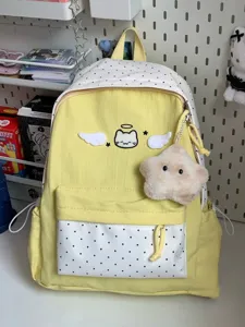 Detail view of the Korean style cute cat wing backpack, large capacity color block design.