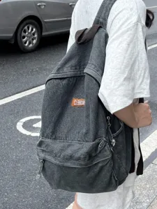Vintage zaino in denim lavato per uomo e donna, grande borsa per la scuola casual.