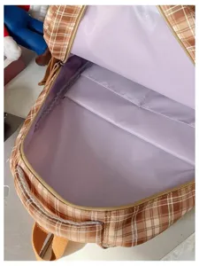 Retro plaid backpack internal detail view, large capacity school bag with storage compartment.