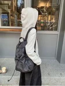 Korean casual polka dot backpack, stylish student travel bag with multiple pockets detail.