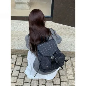 Detailed view of a trendy Korean style polka dot backpack, casual campus design with large capacity.
