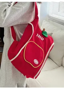 Mochila de lona estilo manzana roja con vista detallada, bolso bandolera bonito para el día a día.