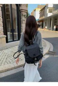 Detail shot of the Korean style polka dot backpack worn outdoors, showcasing everyday casual look.