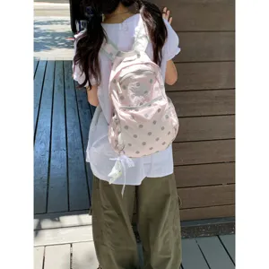 Korean ins style pink polka dot backpack, cute lightweight student school bag with cat design.