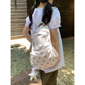 Cute pink polka dot backpack detail view, lightweight casual daily school bag for girls outdoor.