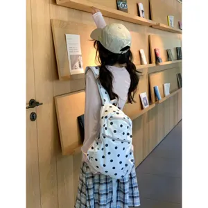 Korean style polka dot student backpack detail view, cute casual lightweight daily school bag.