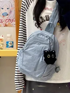 Lightweight nylon mini backpack with cute black cat plush pendant, casual sling bag detail.